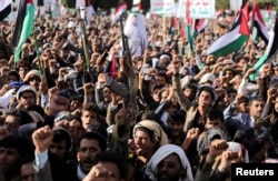 Huthi supporters rally in Sanaa on January 12.