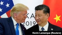 دونالد ترمپ، رئیس‌جمهور ایالات متحده (چپ) شی جین‌پینگ، رئیس جمهور چین (راست) عکس آرشیف