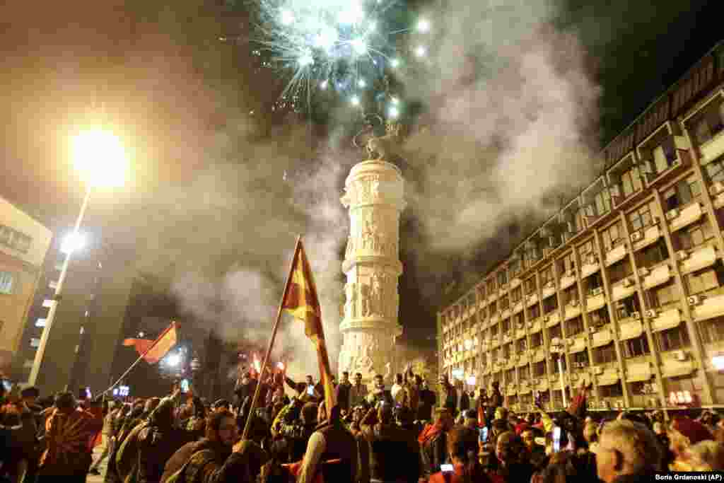 Supporters of the opposition VMRO-DPMNE party celebrate victory in local elections at party headquarters in Skopje on October 31.