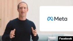 Основатель социальной сети Facebook Марк Цукерберг и логотип Meta.