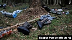 Migrants' belongings lay scattered in the forest near the Belarusian-Polish border near Hajnowka, Poland.