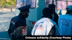 Russian-installed police detain people in Simferopol, Crimea, in 2021. Since illegally annexing Crimea in 2014, Russia has imposed pressure on Crimean Tatars, the peninsula's indigenous ethnic group, many of whom openly protested the annexation.