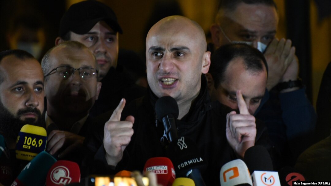 Opposition leader Nika Melia addresses protesters outside parliament in Tbilisi on October 31.
