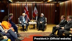 British Prime Minister Boris Johnson (left) meets Iranian President Hassan Rohani (right) at the 74th Session of the UN General Assembly, at UN headquarters in New York on September 24.