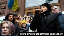 Parliamentary deputy Sofia Fedyna (holding the microphone) near the building of the State Bureau of Investigations on February 12.