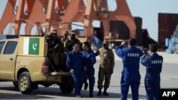 Chinese workers pose for a photograph alongside Pakistani soldiers at the port in Gwadar. (file photo)