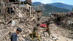 EDITORS NOTE: Graphic content / Afghans walk past damaged houses, after earthquakes at Mazar Dara village in Nurgal district, Kunar province, in Eastern Afghanistan, on September 1, 2025.
