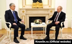Vladimir Putin (right) and Qasym-Zhomart Toqaev chat on February 10.