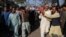 Relatives and locals carry the body of a man who was killed after an angry mob allegedly stoned him to death, in Khanewal district on February 13.
