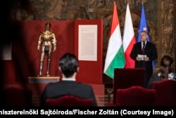 Hungarian Prime Minister Viktor Orban (right) at a formal ceremony returning a suit of armor to Poland in February 2021.