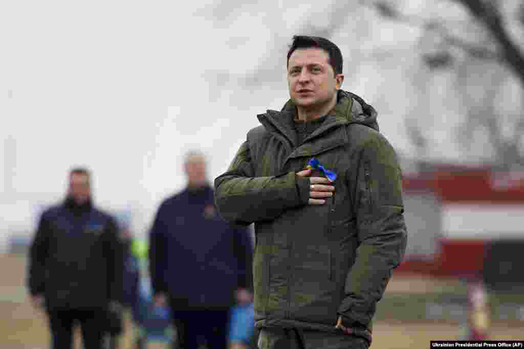 Ukrainian President Volodymyr Zelenskiy listens to the Ukrainian national anthem as he takes part in an event for the Day of the Unity outside Kyiv, prior to his trip to the Rivne and Donetsk regions.&nbsp;Zelenskiy encouraged Ukrainians to &ldquo;hang our national flags, put on blue and yellow ribbons, and show our unity to the whole world.&quot; &nbsp;