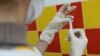 A medical specialist prepares a dose of Sputnik M vaccine against COVID-19 at a clinic in Nizhny Novgorod in February. 