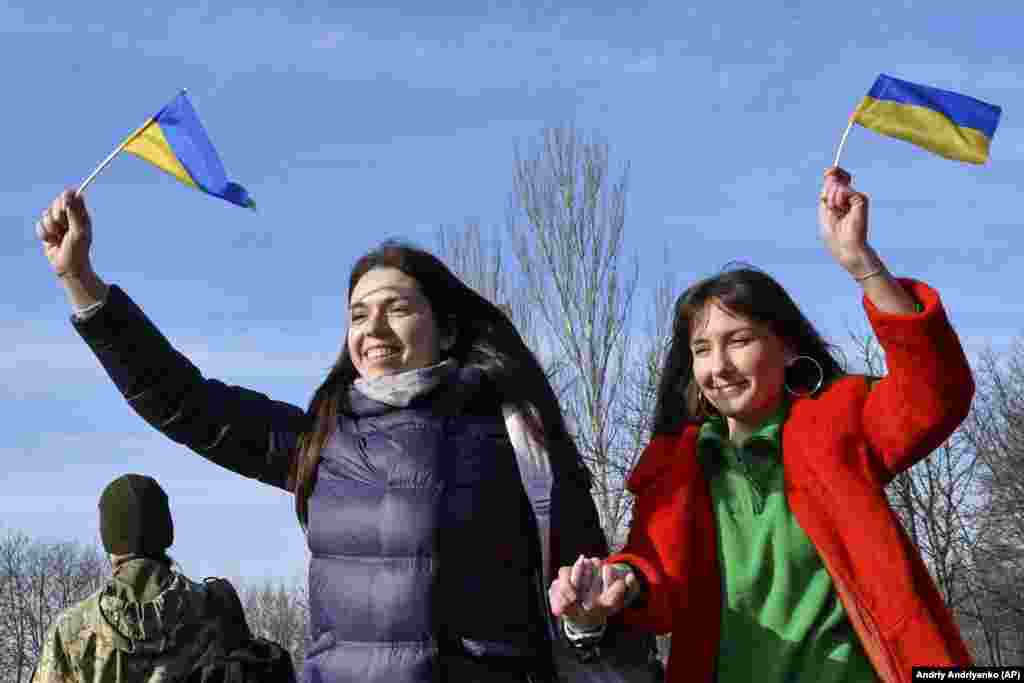 Two women celebrate in Kramatorsk.