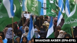 Supporters of the Islamic political party Jamaat-e-Islami (JI) shout anti-India slogans at a protest in Karachi on February 10.