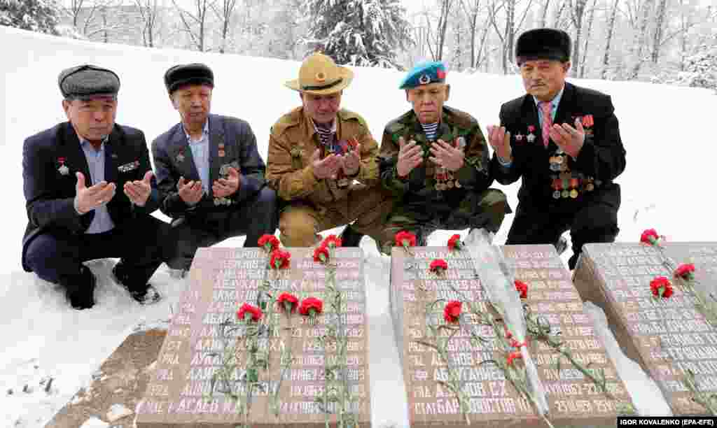 Veterans pray during a memorial service for soldiers killed in Afghanistan, in Bishkek, Kyrgyzstan, on February 15.&nbsp;