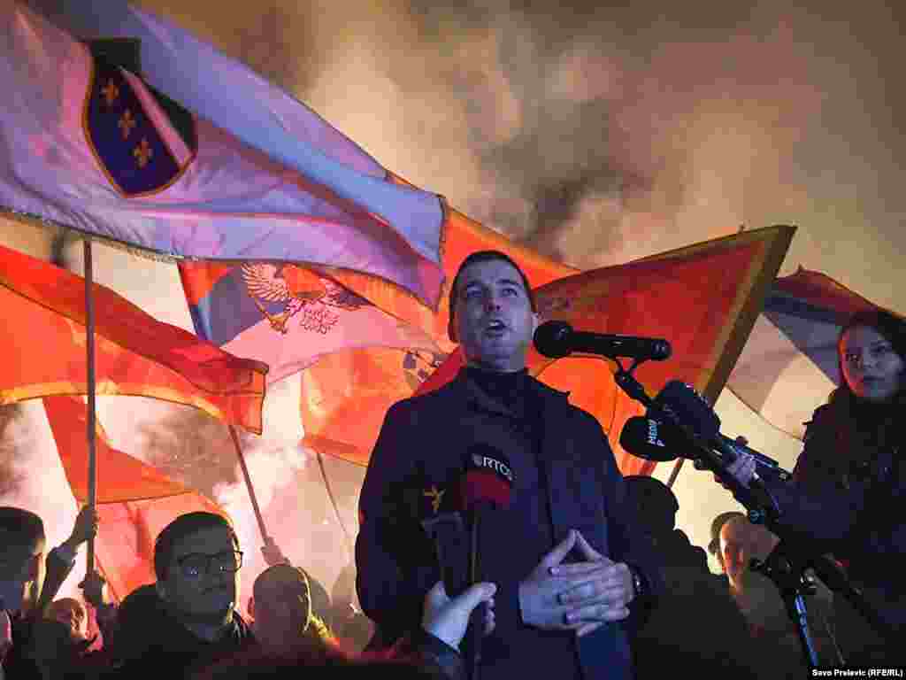 Montenegrin politician Aleksa Becic speaks to demonstrators at a protest rally over the potential formation of a minority government in Podgorica on February 16.&nbsp;