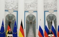 Kancelari gjerman, Olaf Scholz dhe presidenti rus, Vladimir Putin. Fotografi nga arkivi.