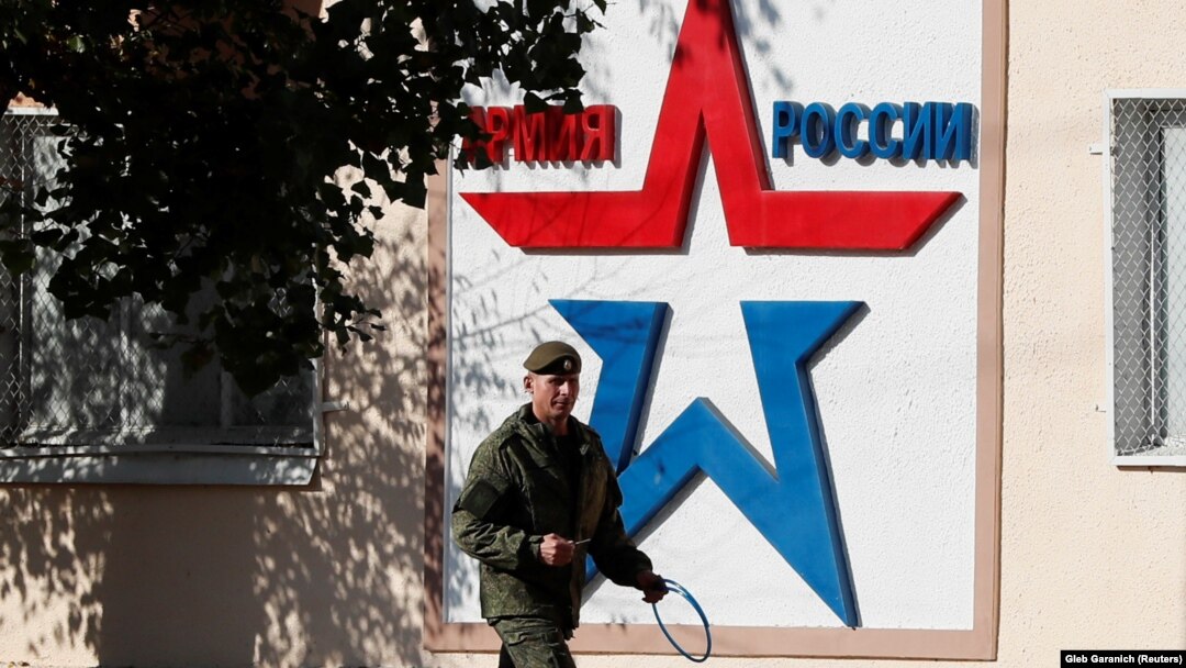 A Russian serviceman walks past the Operational Group of Russian Forces headquarters in Tiraspol, where Moscow maintains some 1,400 troops.
