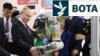 Russian President Vladimir Putin visits an exhibition at the Harbin Institute of Technology in Harbin as part of a 2024 state visit to China. 