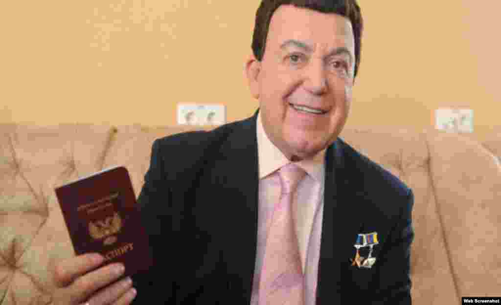 Kobzon shows off a &quot;passport&quot; he was issued by the self-proclaimed Donetsk People&#39;s Republic, an entity created by Russia-backed separatists in eastern Ukraine.