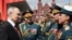 In a photo distributed by Russian state agency Sputnik, Russian President Vladimir Putin greets military commanders after the Victory Day military parade on Red Square in Moscow on May 9.