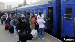 People board an evacuation train in the port city of Odesa this week. 