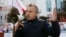 BELARUS -- Anatoly Lyabedzka, the head of United Civic Party of Belarus, talks to a people during an opposition campaign picket for parliamentary elections in Minsk, November 13, 2019