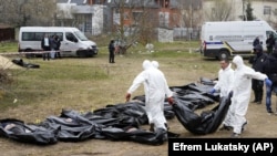 Эксгумация тел убитых в Буче Киевской области