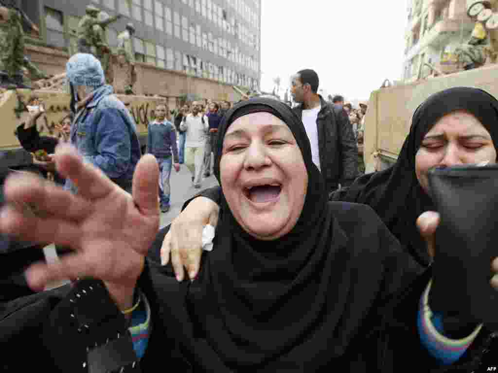 Relatives of demonstrator Mustafa Samer grieve during his funeral in Cairo on January 29.