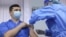 A health worker receives a dose of the AstraZeneca vaccine at a hospital in Chisinau on March 2.