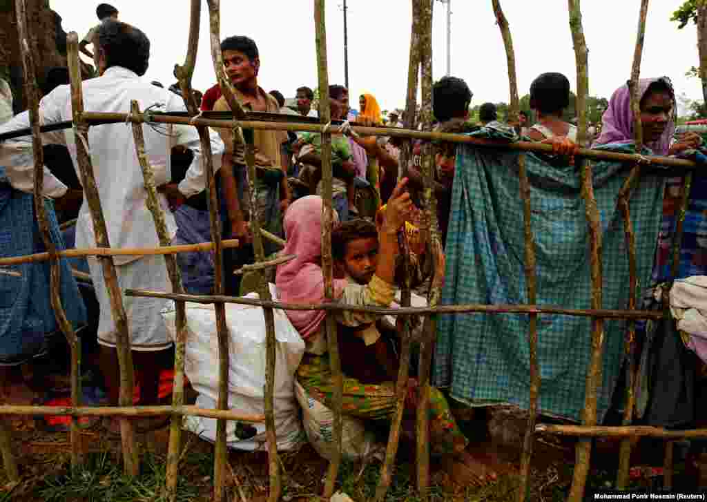 New Rohingya refugees wait to enter a makeshift refugee camp in Cox&rsquo;s Bazar, Bangladesh.