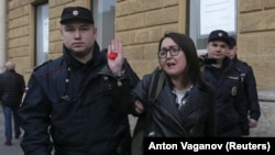 Police detain Yelena Grigoryeva during a rally against discrimination in St. Petersburg on April 17, 2019. She was killed in July.