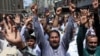 Pakistani Shi'ite Muslims in Karachi raise their hands and chant slogans as they attend an anti-Israel protest on June 13 following its strikes on Iran. 