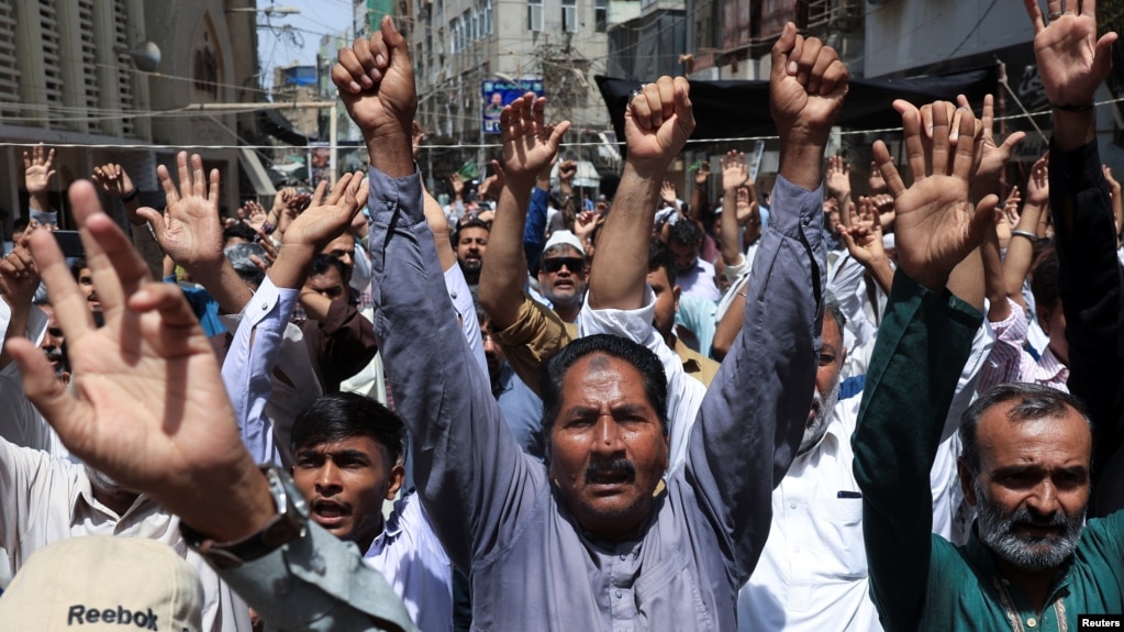 Pakistani Shi'ite Muslims in Karachi raise their hands and chant slogans as they attend an anti-Israel protest on June 13 following its strikes on Iran. 