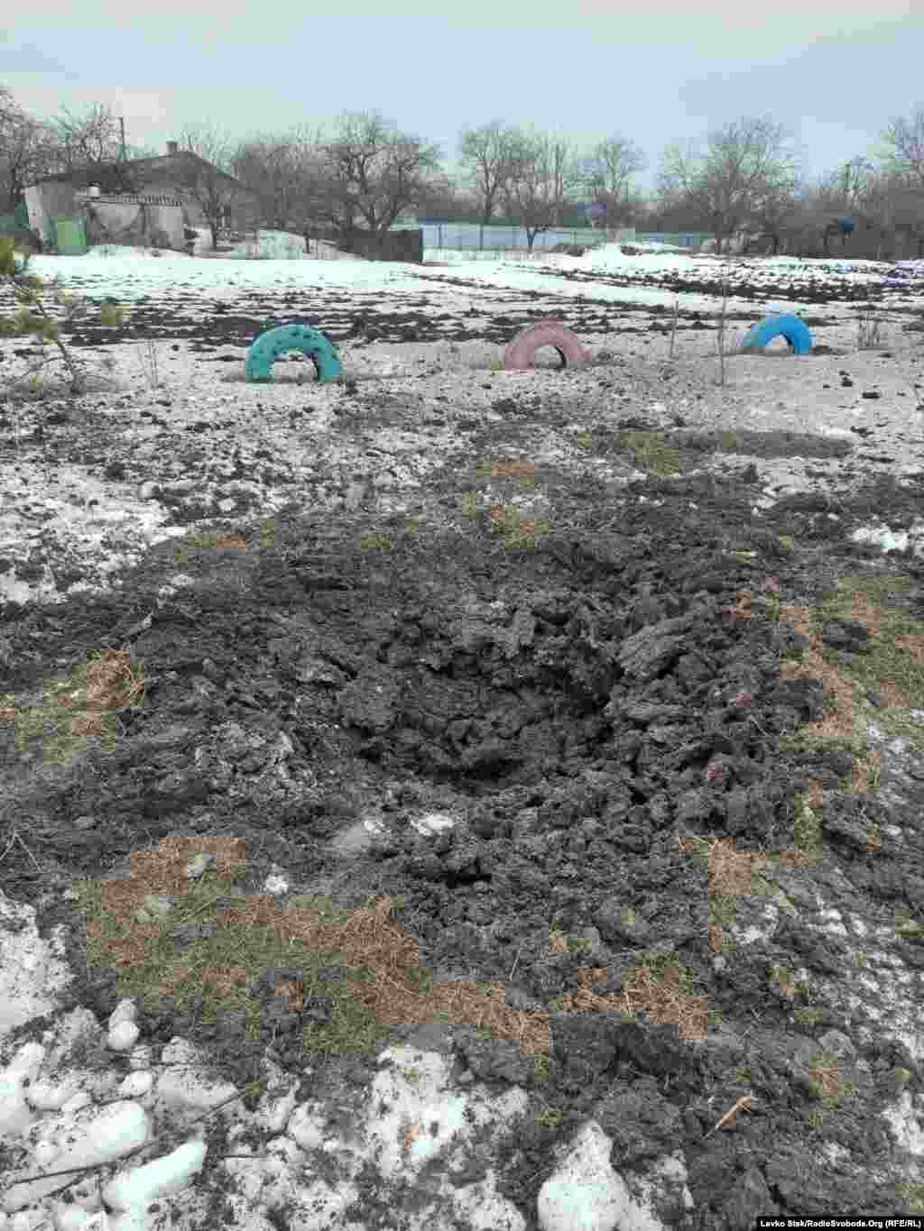 A large crater outside the school.