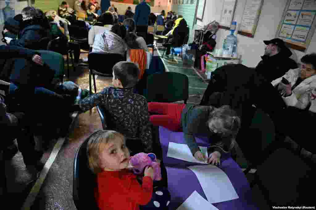 People inside an air-raid shelter in Kyiv on February 25.