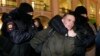 Russia Ukraine Tensions St. Petersburg Protest -- Police officer detain a demonstrator during an action against Russia's attack on Ukraine in St. Petersburg, Russia, Thursday, Feb. 24, 2022. 