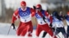 Aleksandr Bolshunov and Artyom Maltsev of the Russian Olympic Committee cross-country skiing in February 2022.