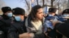 Protesters are detained by police during an anti-war picket at the Russian Consulate in Almaty on February 24.