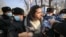 Protesters are detained by police during an anti-war picket at the Russian Consulate in Almaty on February 24.