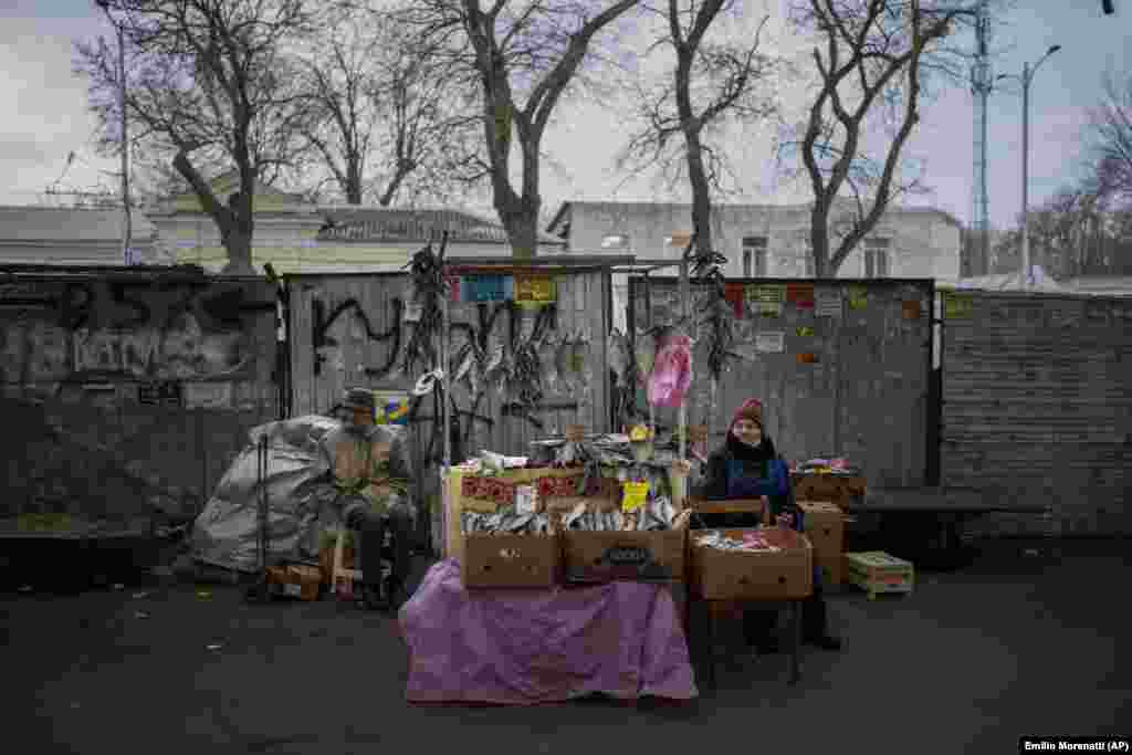 A vendor sells dried fish at her street stall in Odesa, Ukraine.