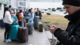 UKRAINE -- People wait at Kyiv Airport after Russian President Vladimir Putin authorized a military operation in eastern Ukraine, February 24, 2022. 