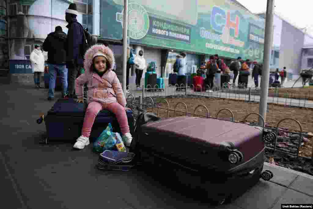 People wait to return to the city at Kyiv&#39;s airport amid Russia&#39;s bombardment.