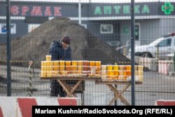 A beekeeper who gave his name only as Anatoliy sells honey, beeswax, and other products at the administrative border checkpoint at Stanytsya Luhanska.