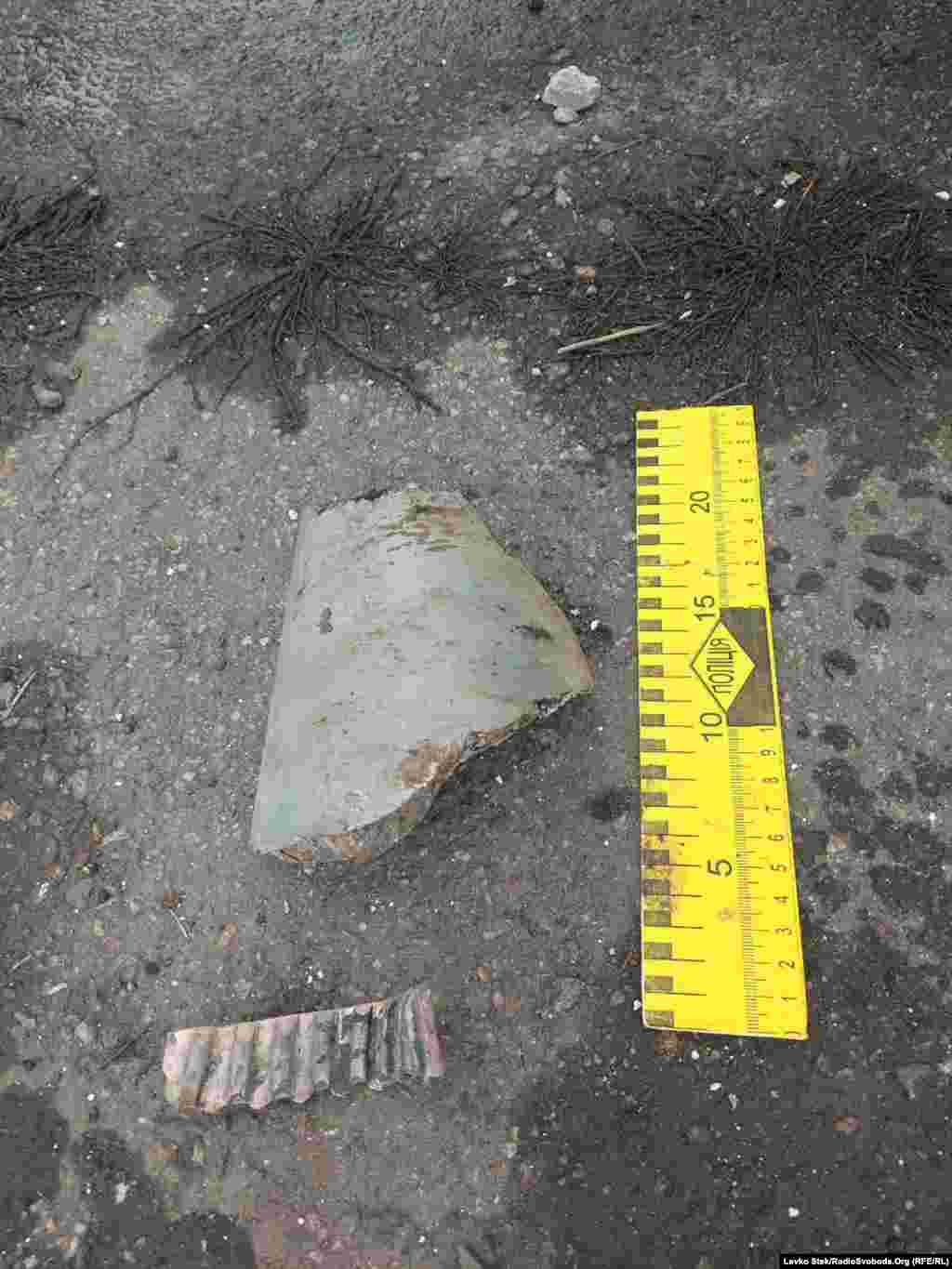 A large shell fragment near the school.
