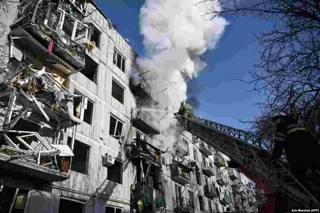 Firefighters work to put out a fire after bombings in the eastern Ukrainian town of Chuhuiv as Russian armed forces try to invade Ukraine from several directions on February 24. (file photo)