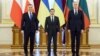Ukrainian President Volodymyr Zelenskiy (center), Polish President Andrzej Duda (left), and Lithuanian President Gitanas Nauseda attend a meeting in Kyiv on February 23. 