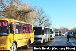 Columns of buses containing evacuees arrive at a camp in Russia's Rostov region.
