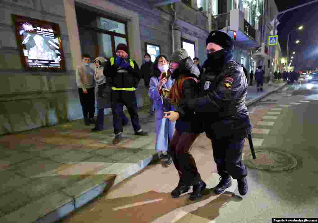 A protestor is detained by police in Moscow.&nbsp;