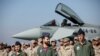 Spanish pilots and soldiers stand in front of a Spanish Eurofighter Typhoon jet during a ceremony at Graf Ignatievo air base in central Bulgaria on February 17.<br />
<br />
<span style="font-size: 1em;">German and Spanish jets arrived at&nbsp;military bases in&nbsp;Romania and Bulgaria on February 17&nbsp;as part of a deployment of airpower to NATO&#39;s eastern flanks amid tensions between Russia and Ukraine.&nbsp;</span>